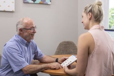 An Elderly Man Having a Hearing Consultation