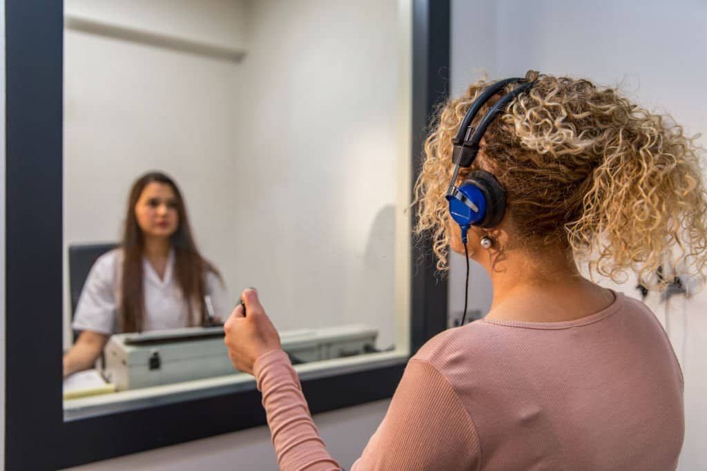 Audiologist Conducting Hearing Test