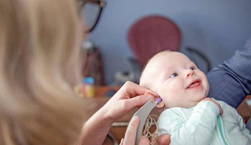 An Infant Undergoing A Hearing Assessment